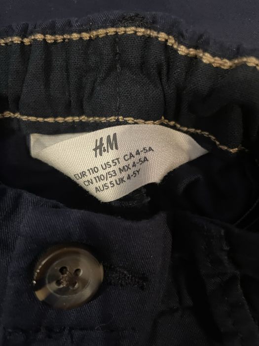 Bawełniane ekeganckie spodnie H&M 116