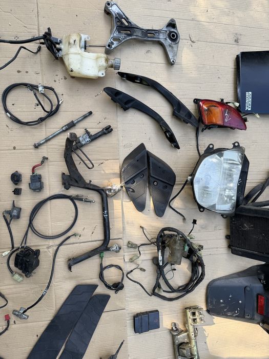 Honda Pantheon 150 owiewka lampa czujnik kiwak instalacja uchwyt wąż