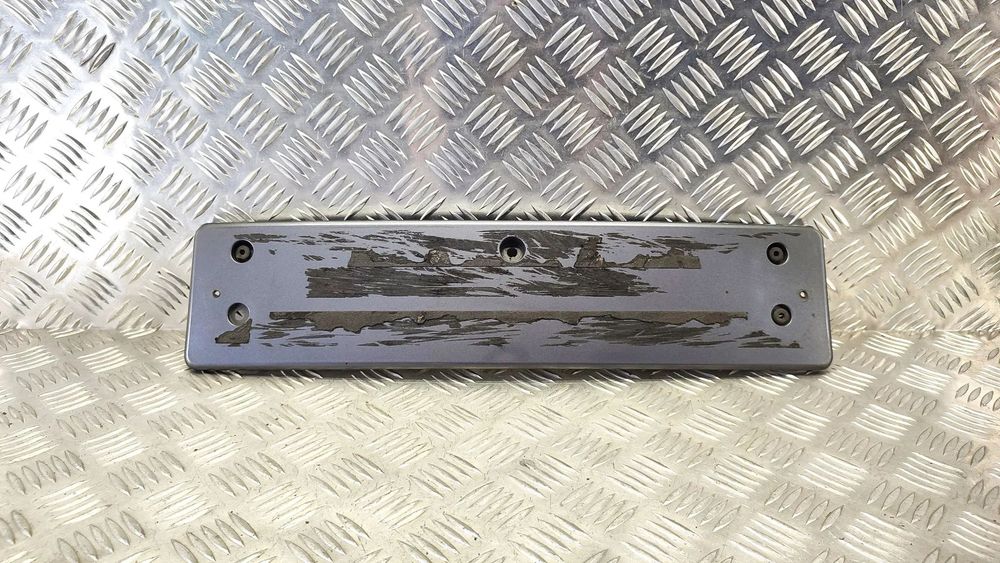 VW TOUAREG 7L 03-09R PODKLADKA PODSTAWA TABLICY REJESTRACYJNEJ LD7Z PRZOD 7L6807287 H