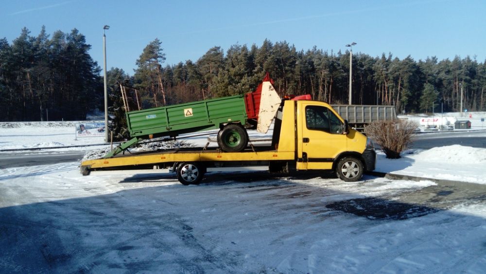 Transport maszyn rolniczych przewóz belar przyczep pługów laweta