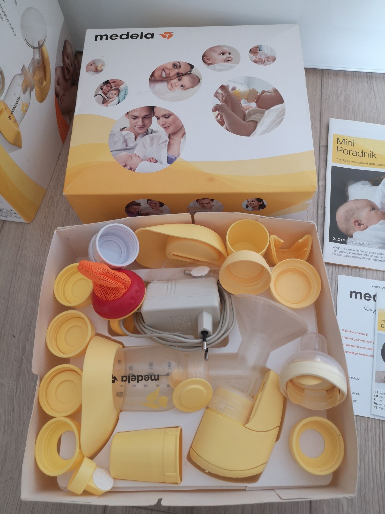 Laktator Medela Mini Electric, akcesoria, nowy smoczek, butelka