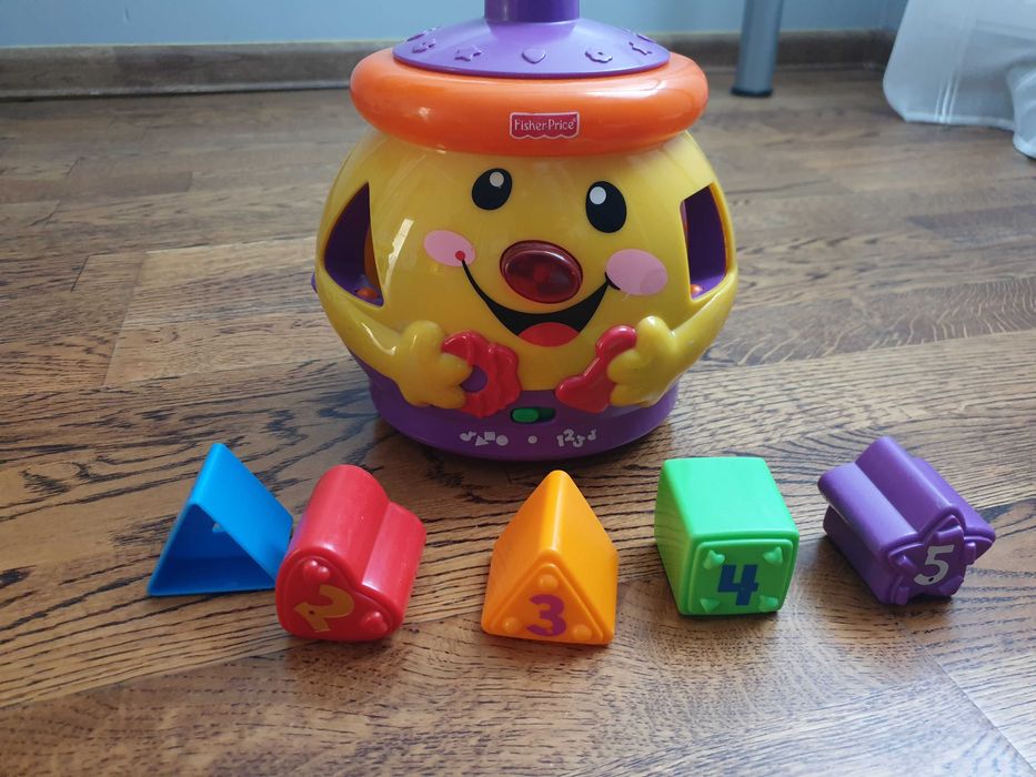 Garnuszek na klocuszek Fisher Price