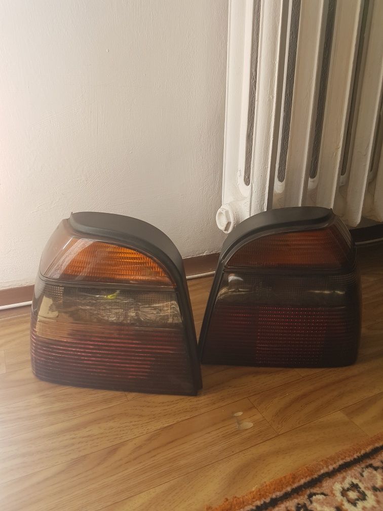 Lampy tylne dymione oryginał Hella golf 3, komplet