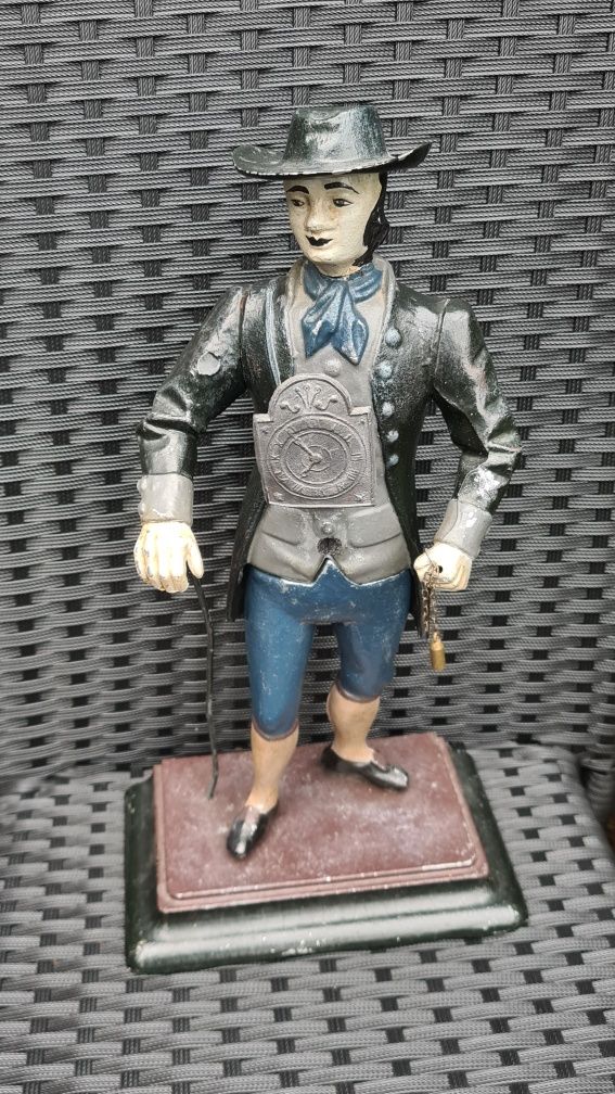 Zegar figuralny, figura sprzedawca zegarów