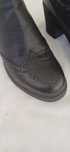 Botas pretas com sola borracha