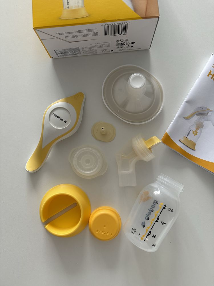 Молокосос Medela ручний + пакети для молока