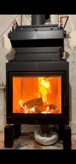 Каміни топки з водяним контуром.Водяним теплообмінником.Продаж,монтаж.