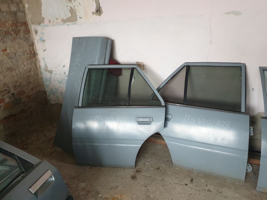 Двері мазда 626 86р седан