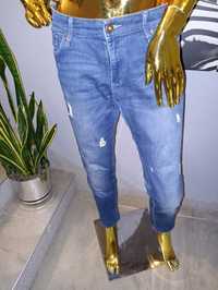 Ciemne jeansowe spodnie z przetarciami Skinny R.40/42