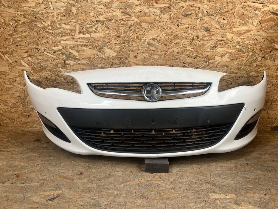 ZDERZAK PRZEDNI przód OPEL ASTRA J IV 4 LIFT PDC Halogeny BIAŁY