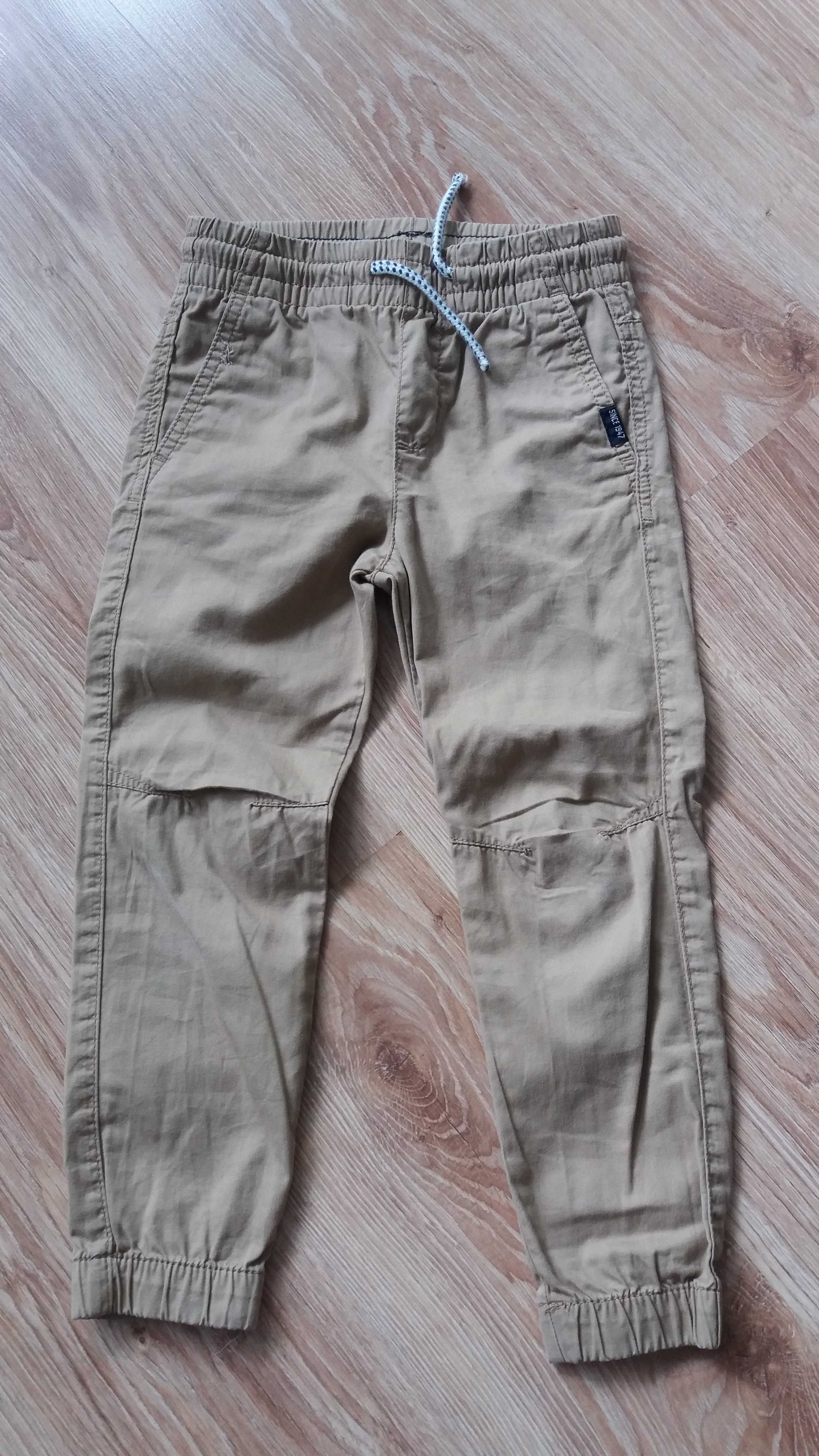 Spodnie H&M dla chłopca z cienkiego materiału rozm 110