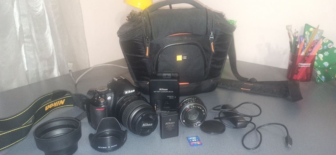 Продам фотоаппарат Nikon d3100 + МС Helios 81 Н