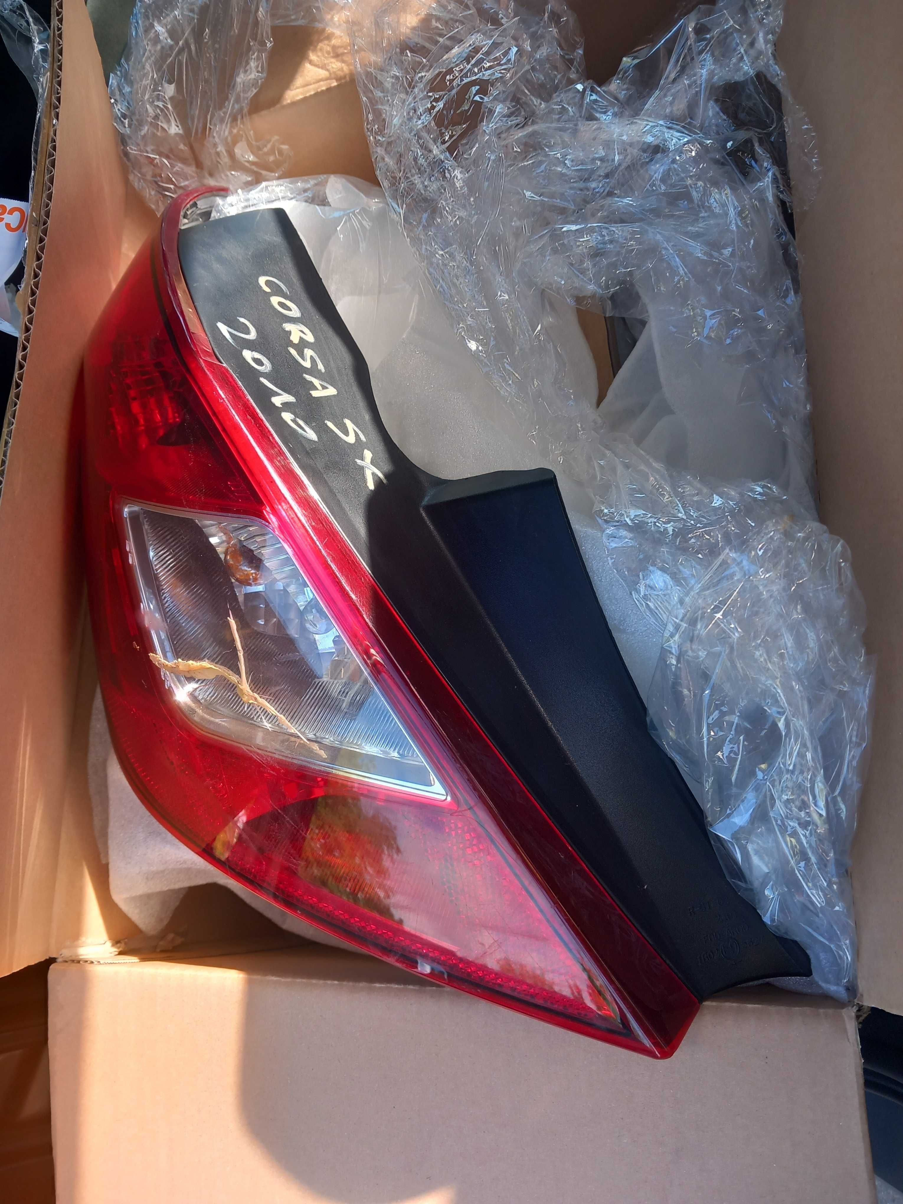 Lampa tył opel corsa d lewa reflektor lewy pajączek