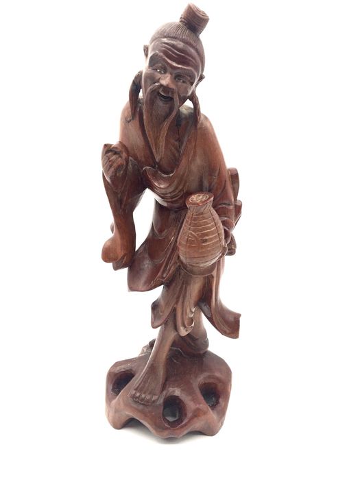 Escultura oriental em madeira zodiaca
