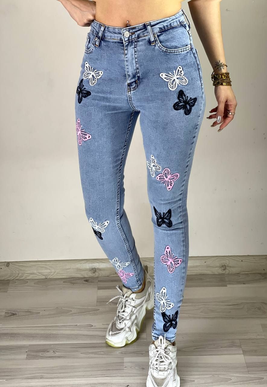 Spodnie jeans damskie w motyle S-XL