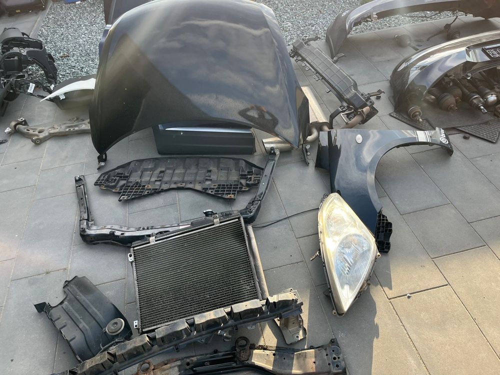 Błotnik lewy Suzuki Swift mk7 ZCE czarny igła