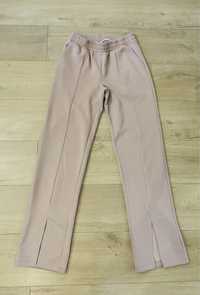 Spodnie materiałowe dresowe z rozcięciem reserved rozmiar xs