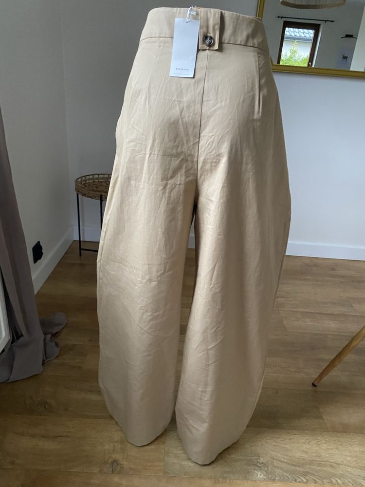 Jasne nowe spodnie dzwony modne spodnie xl