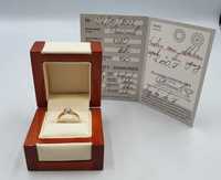Złoty pierścionek z brylantem p.750 4,52 gr  + certyfikat