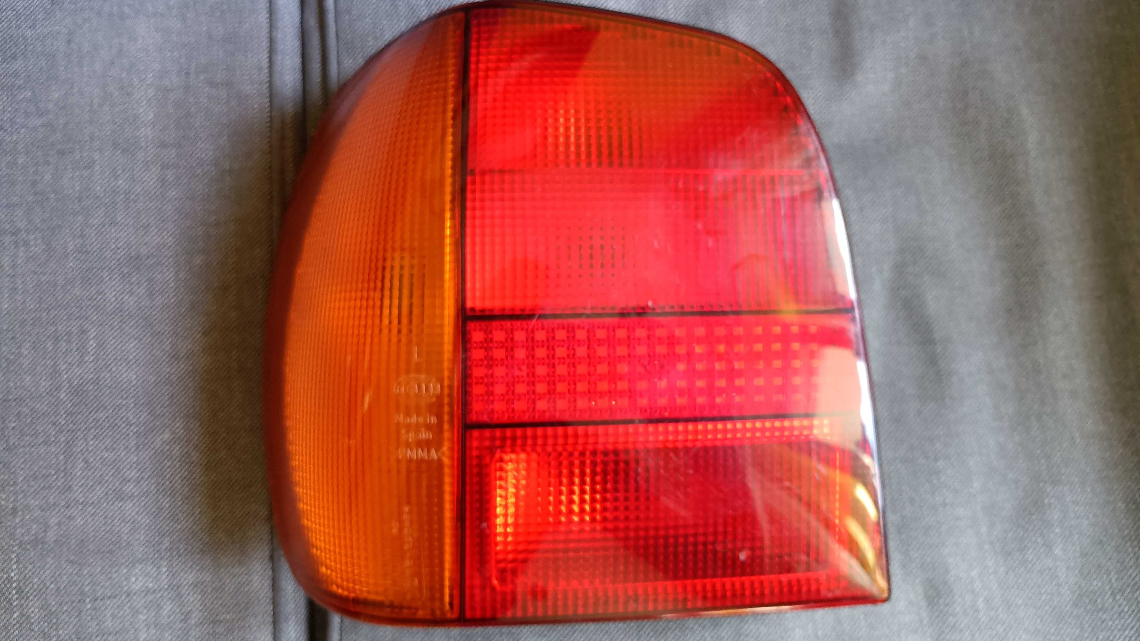 Lampa lewa tylna tył VW Polo 94-99 Hella
