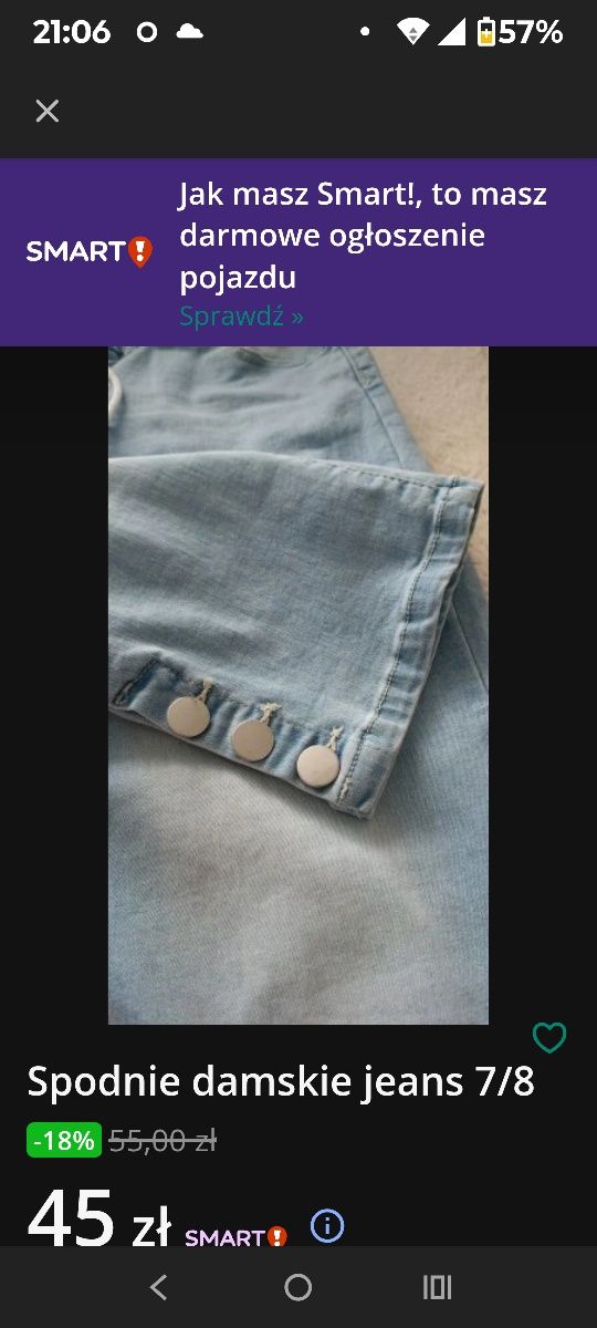 Spodnie jeans 7/8  z ozdobnymi guzikami u dołu spodni .