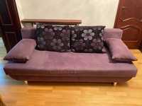 Fioletowa sofa rozkładana