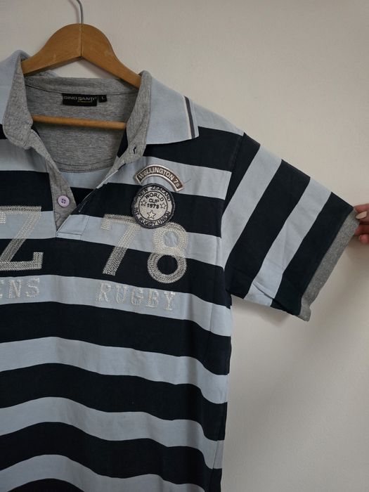 Męska koszulka polo w paski 
Bawełna
W błękitno-granatowe paski

Wymia