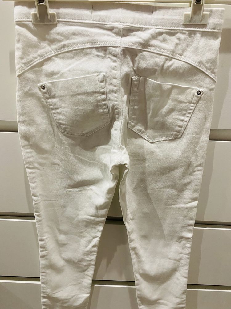 Białe NOWE spodnie rurki legginsy 32/34 XXS/XS