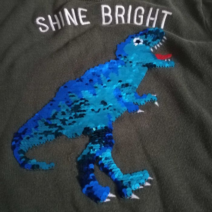Sweterek chłopięcy H&M z hologramowym dinozaurem r. 122/128