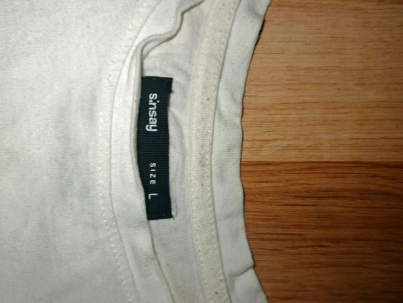 Damska biała koszulka z nadrukiem w rozmiarze L