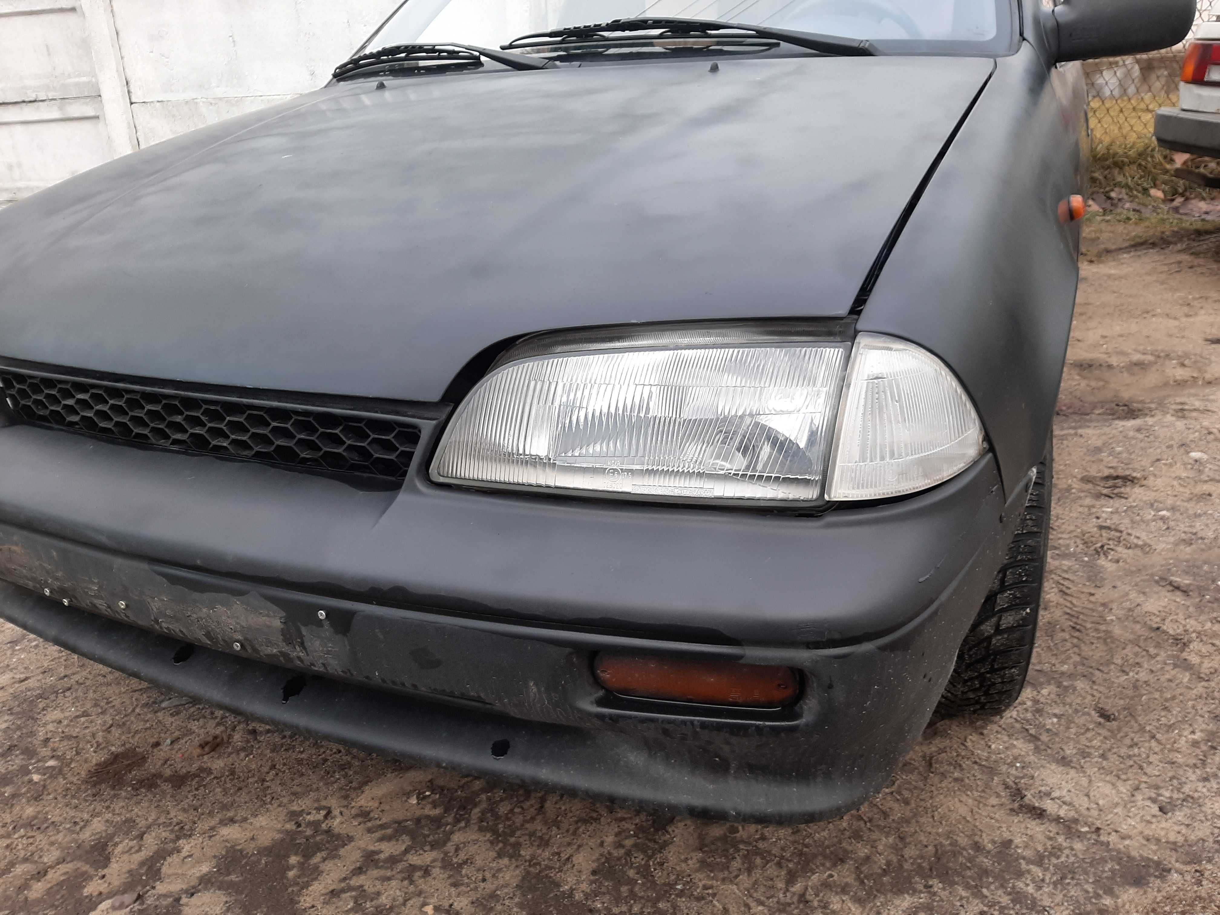 Suzuki Swift 1.0i 1996r.Lampa przednia lewa