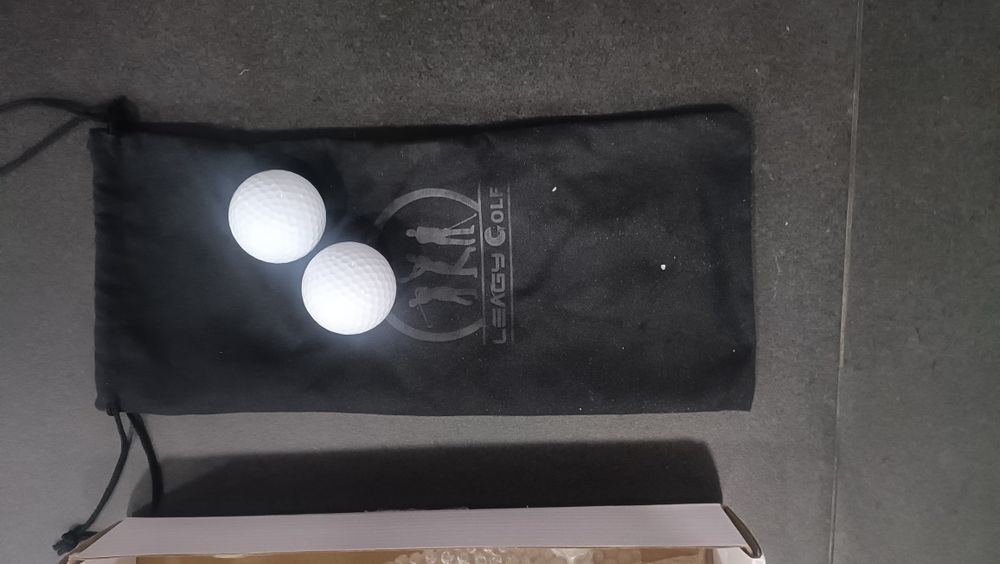 Taco de golfe e bolas