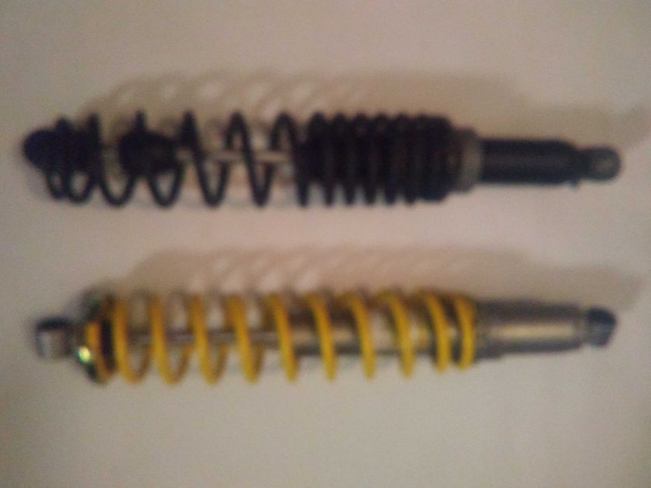 Пара нових амортизаторів снігоход