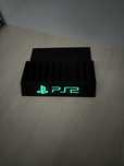 Stojak podstawka na gry PS2 napis fluorescencyjny