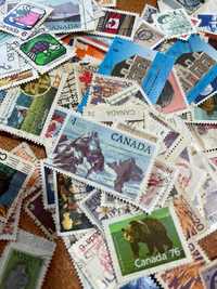 Vários lotes de 100 selos antigos do Canadá