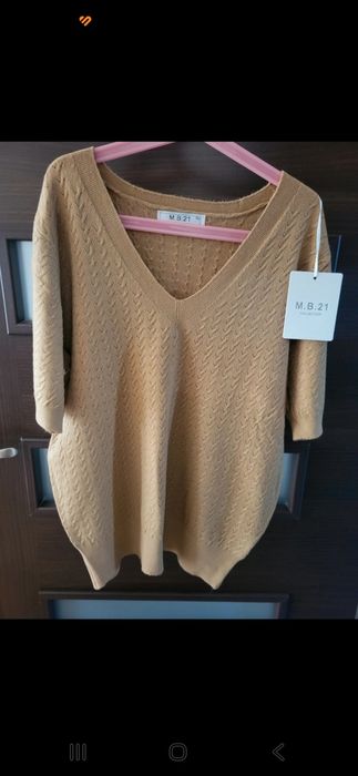 Nowy z metką sweterek