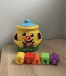 Garnuszek na klocuszek Fisher Price sorter zabawka interaktywna