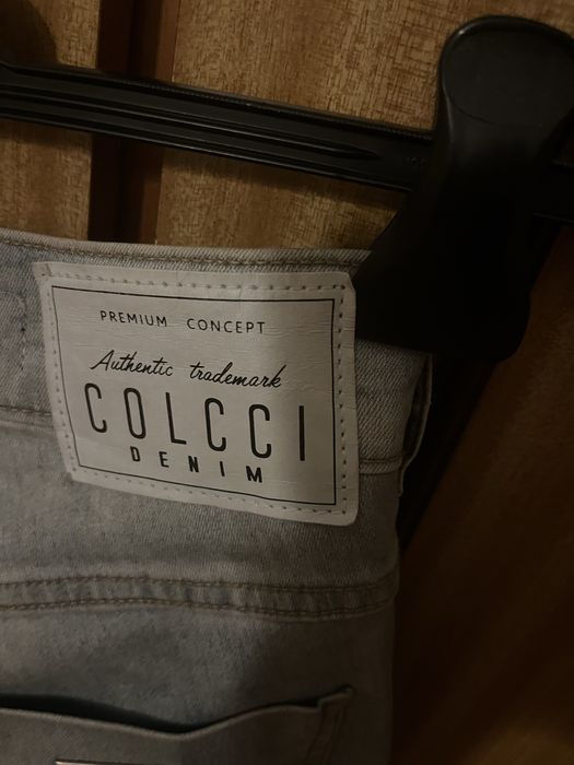 Calças Colcci de ganga elásticas,com recortes dos lados,como novas,36