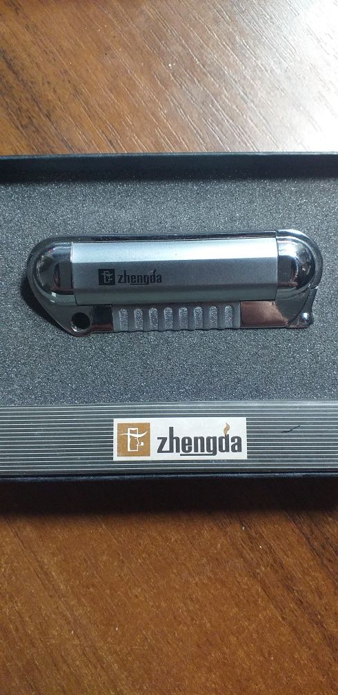 Продам подарочную зажигалку Zhenga