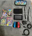 Konsola switch + 4 gry + etui ochronne
