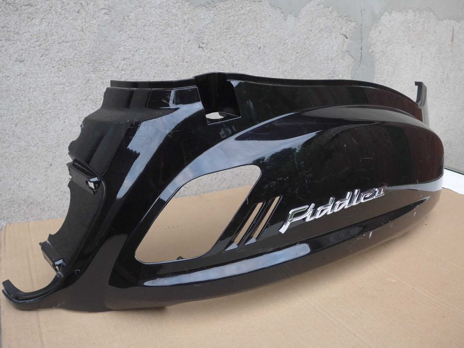 Sym Fiddle II '08-14r OWIEWKA prawy tył emblemat