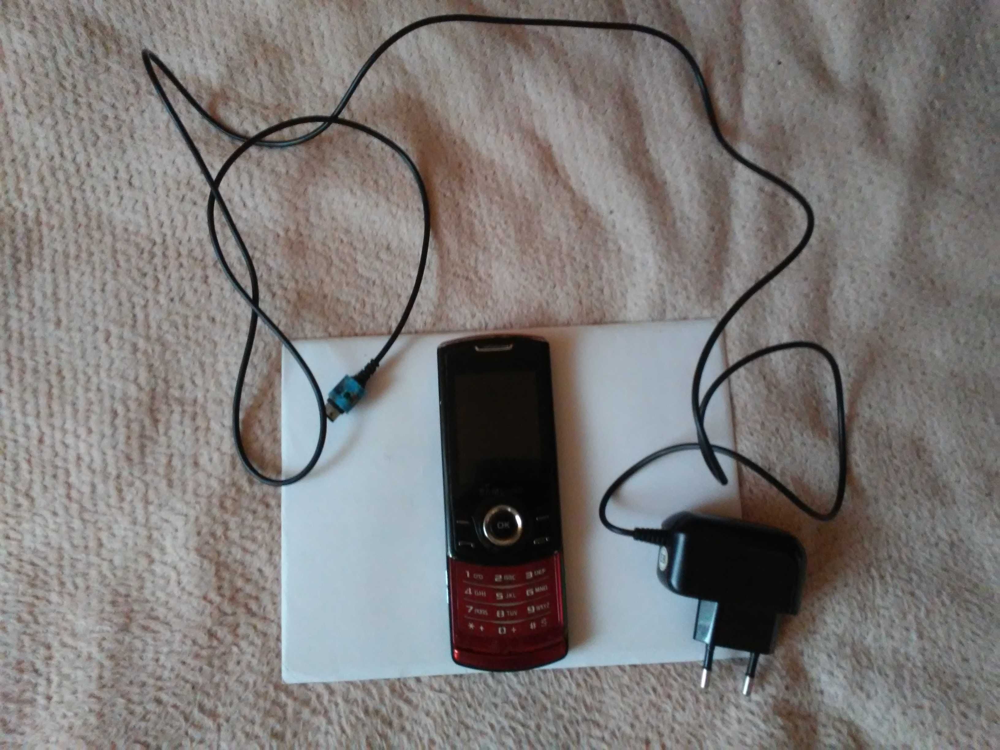 Telefon Samsung (uszkodzony) + ładowarka