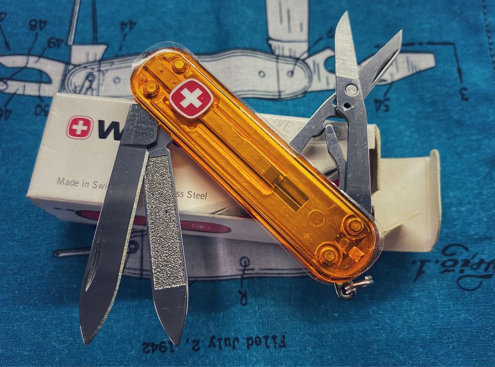 Nowy Wenger Esquire, 65 mm, transparentny pomaranczowy, jak Victorinox