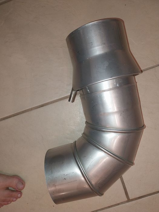 Kolano  fi 130 z odskraplaczem poziomym