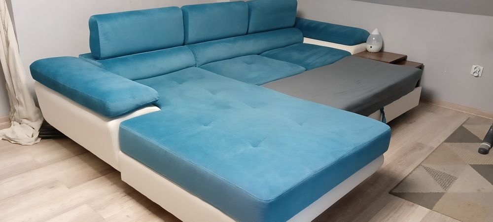 Kanapa rogówka z funkcją spania i pojemnikiem