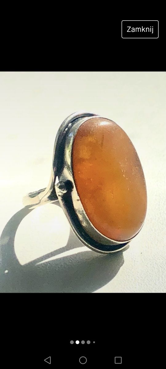 Duży , srebrny pierścionek ze słonecznym bursztynem