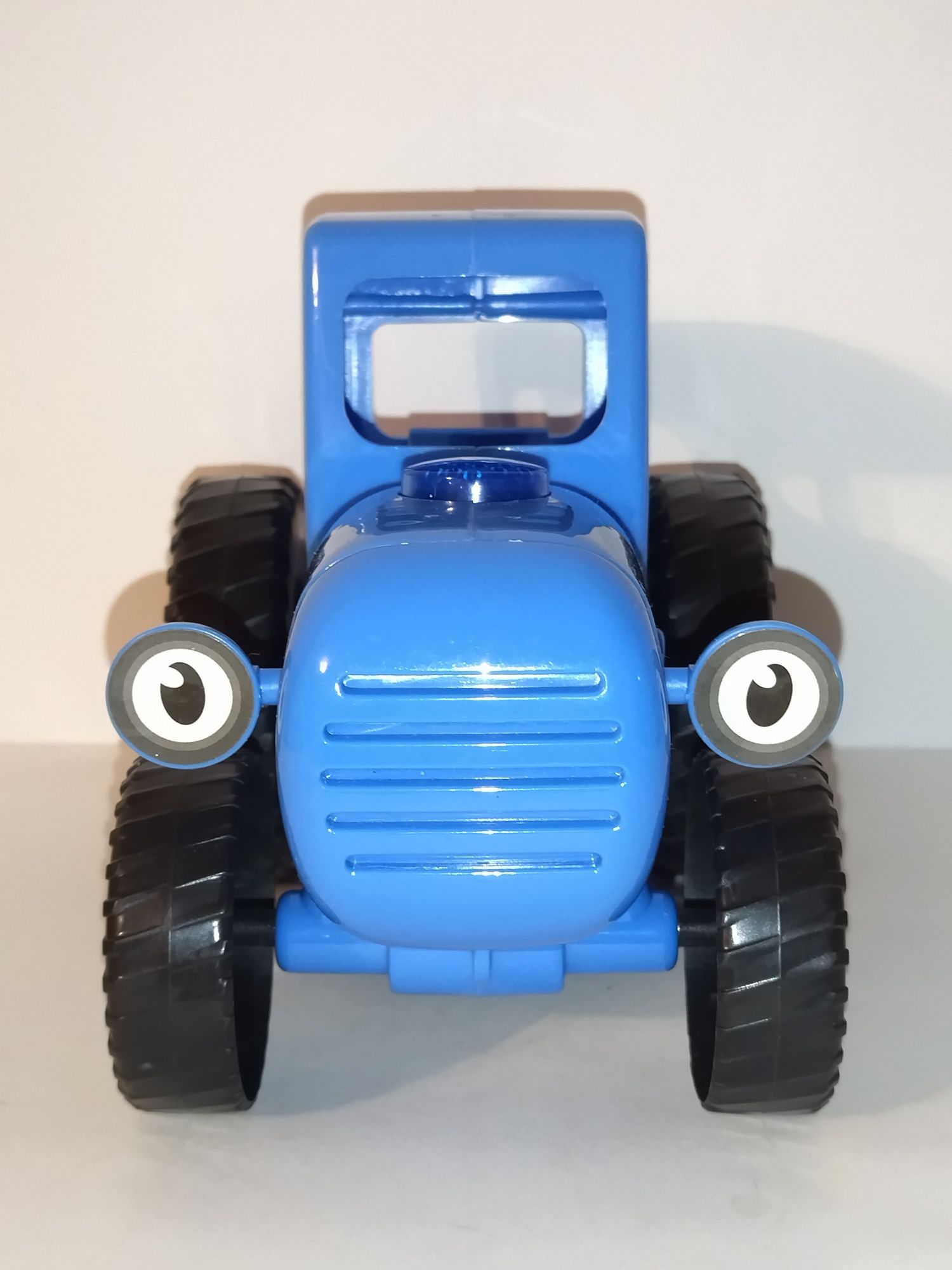 Игрушка "Синий Трактор" музыкальный с палкой каталкой.