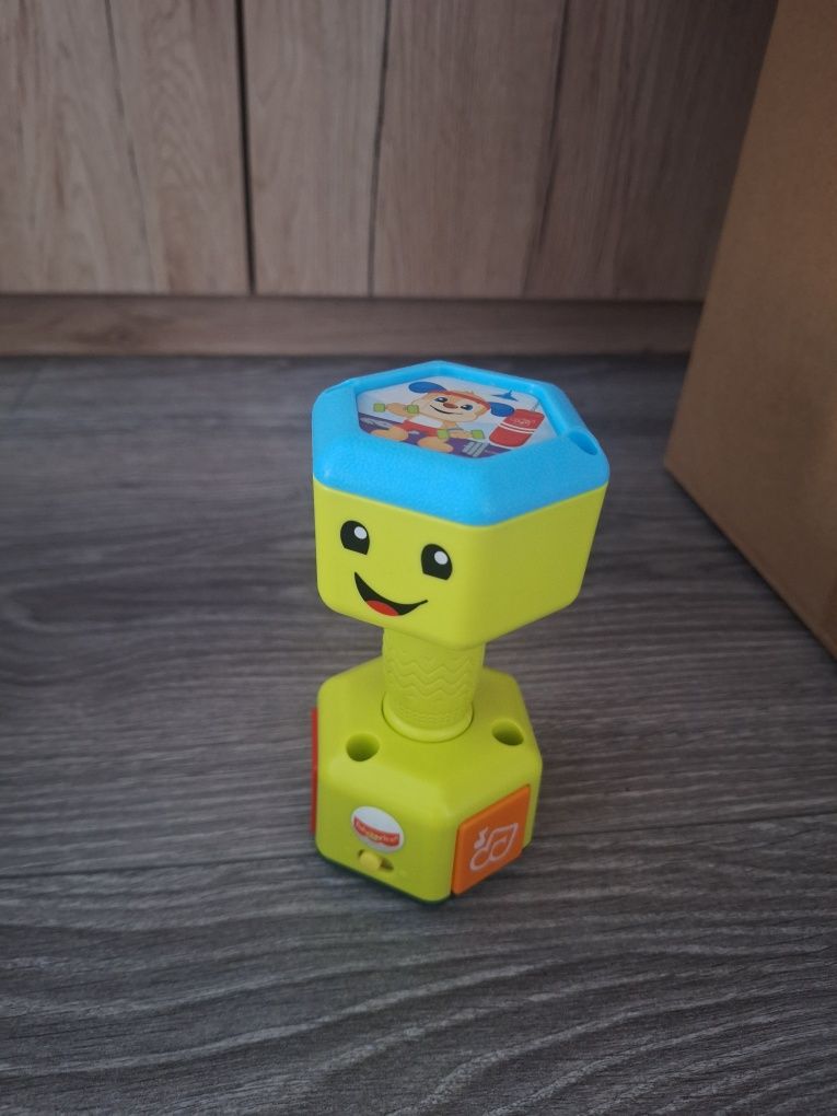 Muzyczny handel Fisher price grzechotka