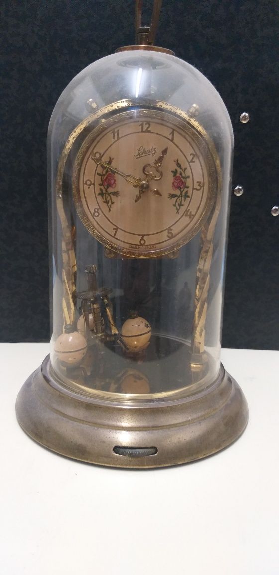 Relógio pendulo giratório