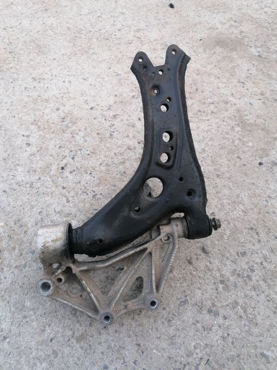 VW SKODA SEAT PRAWY WACHACZ Z WSPORNIKEM ORGINAL 600199294D